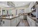 Kitchen with granite countertops, white cabinets, stainless steel appliances, and an island at 28019 N 115 Pl, Scottsdale, AZ 85262