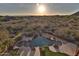 Aerial view of a custom pool and spa with desert landscape in the background at 2918 N 90Th St, Mesa, AZ 85207