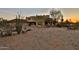Stunning Southwestern-style home with desert landscaping and a charming red tile roof at sunset at 2918 N 90Th St, Mesa, AZ 85207