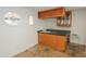 Home wet bar features custom cabinets and countertop space for entertaining at 3371 W Grandview Rd, Phoenix, AZ 85053