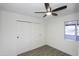 An airy bedroom with stylish vinyl flooring, large closet, a ceiling fan, and natural light at 3371 W Grandview Rd, Phoenix, AZ 85053