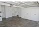 A well-organized garage with ample storage cabinets and a clean, finished floor at 3371 W Grandview Rd, Phoenix, AZ 85053