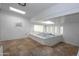 Bright sunroom features an indoor hot tub with tile flooring, providing relaxation and wellness at 3371 W Grandview Rd, Phoenix, AZ 85053