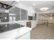 Bright modern kitchen with bar seating and stainless steel appliances at 3371 W Grandview Rd, Phoenix, AZ 85053