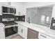 Beautiful kitchen featuring white cabinetry and stainless steel appliances at 3371 W Grandview Rd, Phoenix, AZ 85053