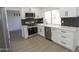 Well-equipped kitchen boasting stainless steel appliances and subway tile backsplash at 3371 W Grandview Rd, Phoenix, AZ 85053