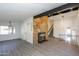 Open-concept living area features a stone fireplace and hardwood floors throughout at 3371 W Grandview Rd, Phoenix, AZ 85053