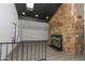 Bright living room featuring a striking stone fireplace and skylight at 3371 W Grandview Rd, Phoenix, AZ 85053