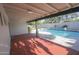 Covered patio near pool provides shade and enhances outdoor entertaining near a refreshing swimming pool at 3371 W Grandview Rd, Phoenix, AZ 85053