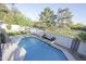 Sparkling private pool with stone patio, lush landscaping, and tranquil backyard oasis at 3371 W Grandview Rd, Phoenix, AZ 85053