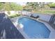 Sparkling in-ground pool surrounded by a landscaped backyard and a privacy fence at 3371 W Grandview Rd, Phoenix, AZ 85053