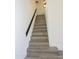 Newly carpeted staircase with modern lighting at 3371 W Grandview Rd, Phoenix, AZ 85053