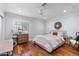 Bedroom features wood floors, neutral paint, and natural light at 3411 E Sells Dr, Phoenix, AZ 85018