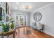 Welcoming foyer with hardwood floors, bench seating and natural light at 3411 E Sells Dr, Phoenix, AZ 85018