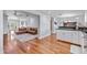 Open living space featuring hardwood flooring leading into the kitchen at 3411 E Sells Dr, Phoenix, AZ 85018