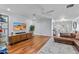 Spacious living room with hardwood floors, neutral paint, and ample lighting at 3411 E Sells Dr, Phoenix, AZ 85018