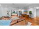 Open-concept living room with hardwood floors connecting to the kitchen at 3411 E Sells Dr, Phoenix, AZ 85018