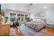 Bedroom features wood floors, natural light, and access to the backyard at 3411 E Sells Dr, Phoenix, AZ 85018