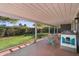 The patio is covered and has string lights hanging for evening enjoyment at 3411 E Sells Dr, Phoenix, AZ 85018