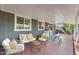The covered patio has seating and a play area at 3411 E Sells Dr, Phoenix, AZ 85018