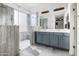 Elegant bathroom featuring a glass shower, double vanity, and modern fixtures at 35616 N 34Th Ln, Phoenix, AZ 85086