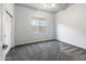 Neutral bedroom with gray carpet, ample natural light, and a closet at 35616 N 34Th Ln, Phoenix, AZ 85086