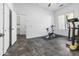 Bright bonus room or bedroom featuring an exercise bike, ceiling fan, and abundant natural light at 35616 N 34Th Ln, Phoenix, AZ 85086
