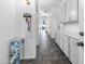 Hallway with long built-in cabinets for storage, offering organization and functionality at 35616 N 34Th Ln, Phoenix, AZ 85086
