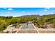 Aerial view of gated entrance to a planned community surrounded by lush desert landscaping at 38940 N 54Th St, Cave Creek, AZ 85331