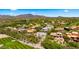 Aerial view of an Arizona community with desert landscaping, a golf course, and mountain views at 38940 N 54Th St, Cave Creek, AZ 85331