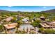 Aerial view of real estate lot with partial foundation near a golf course in a desert community at 38940 N 54Th St, Cave Creek, AZ 85331