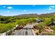 Scenic aerial view of gated community with lush landscaping, golf course, and mountain views at 38940 N 54Th St, Cave Creek, AZ 85331