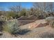 Rancho Mañana Private Homes stone sign with desert landscaping and mature trees at 38940 N 54Th St, Cave Creek, AZ 85331