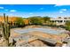 New home foundation on a desert property with block perimeter walls surrounded by vegetation at 38940 N 54Th St, Cave Creek, AZ 85331