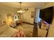 Stylish bedroom with makeup vanity, ample light, carpet and wood look flooring at 41143 W Rio Bravo Dr, Maricopa, AZ 85138