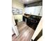 Efficient laundry room with modern appliances and custom cabinets for ample storage at 41143 W Rio Bravo Dr, Maricopa, AZ 85138