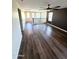 Spacious living room showcasing wood floors, high ceilings, and natural light at 41143 W Rio Bravo Dr, Maricopa, AZ 85138