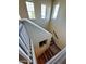 Open staircase design with wood steps and decorative niche at 41143 W Rio Bravo Dr, Maricopa, AZ 85138
