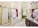 Bright bathroom with a tub, shower, and a view into the main bedroom at 4346 E Prickly Pear Trl, Phoenix, AZ 85050