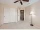 Bedroom with neutral paint and carpet and bi-fold door closet, with adjacent bathroom entrance at 4346 E Prickly Pear Trl, Phoenix, AZ 85050