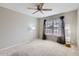Comfortable bedroom with carpeted floors, a bright window and stylish furnishings at 4346 E Prickly Pear Trl, Phoenix, AZ 85050