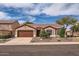 Charming single-story home featuring a two car garage, neutral paint, and a well-manicured front yard at 4346 E Prickly Pear Trl, Phoenix, AZ 85050