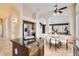 Open concept kitchen features an island, granite countertops, stainless appliances and views to the dining area at 4346 E Prickly Pear Trl, Phoenix, AZ 85050