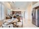 Open concept kitchen with stainless appliances, granite countertops, an island, and views to the eat-in dining area at 4346 E Prickly Pear Trl, Phoenix, AZ 85050