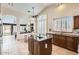 Bright and airy kitchen featuring an island, granite countertops, stainless appliances and views to the dining area at 4346 E Prickly Pear Trl, Phoenix, AZ 85050