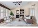 Bright living room with plush seating, modern fireplace, and lots of natural light at 4346 E Prickly Pear Trl, Phoenix, AZ 85050