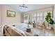 Relaxing living room with sliding glass doors to the pool, plantation shutters, and comfortable seating at 4346 E Prickly Pear Trl, Phoenix, AZ 85050