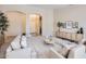 Inviting living room featuring neutral paint, modern furnishings, neutral carpet, and archways at 4346 E Prickly Pear Trl, Phoenix, AZ 85050