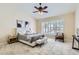 This is a bright and spacious main bedroom featuring large windows and stylish decor elements at 4346 E Prickly Pear Trl, Phoenix, AZ 85050