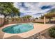 Backyard with a swimming pool, patio, mature trees, and desert landscaping at 4346 E Prickly Pear Trl, Phoenix, AZ 85050